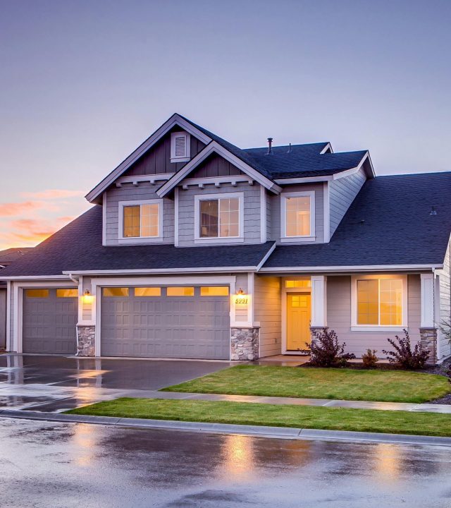 pexels-photo-186077-186077 Elegant suburban home with driveway at sunset showcasing modern architecture.