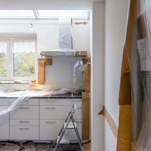 Photo by immo RENOVATION white wooden cabinet near window